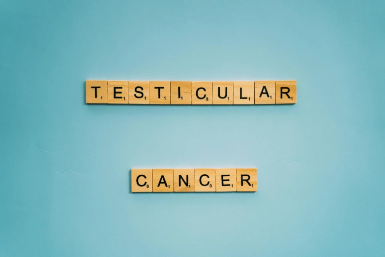 the words test collar and cancer spelled in scrabbles on a blue background, an album cover, tesla, canva, ut 4, tehnicolor