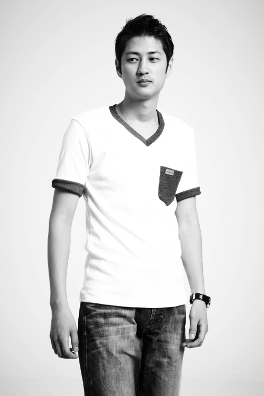 a black and white photo of a man with a skateboard, inspired by Ding Yunpeng, wearing white v - neck top, with two front pockets, minimal clothing, ismail