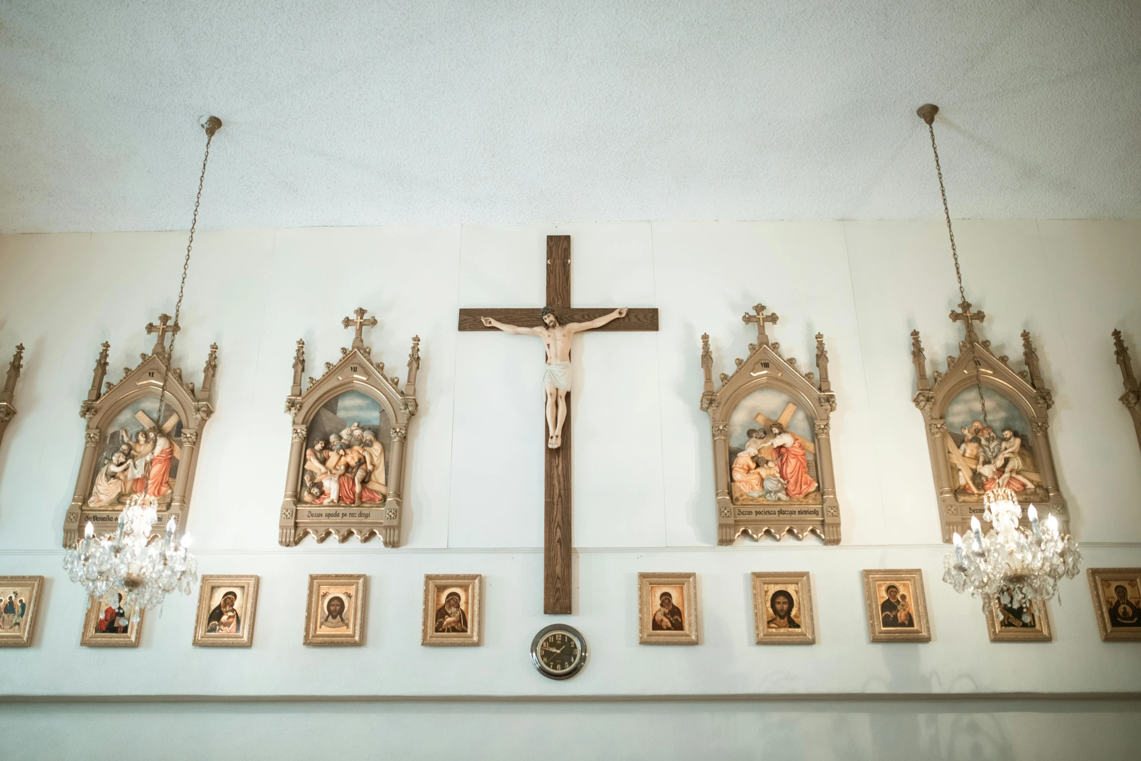 a cross hanging from the ceiling of a church, a portrait, unsplash, renaissance, gallery display photograph, roman catholic icon, group photo, decoration around the room