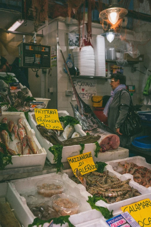 a fish market filled with lots of different types of fish, a photo, by Giuseppe Avanzi, square, colorful signs, full-body, low quality photo