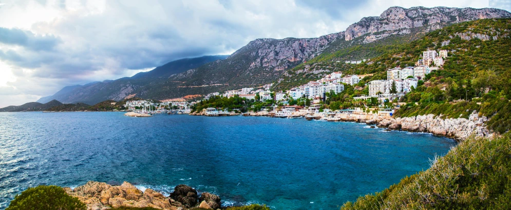 a large body of water next to a lush green hillside, pexels contest winner, hurufiyya, whitewashed buildings, mount olympus, sparkling cove, panoramic