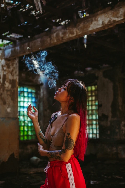 a woman smokes a cigarette in an abandoned building, inspired by Elsa Bleda, pexels contest winner, with tattoos, ganja, ✨🕌🌙, profile image