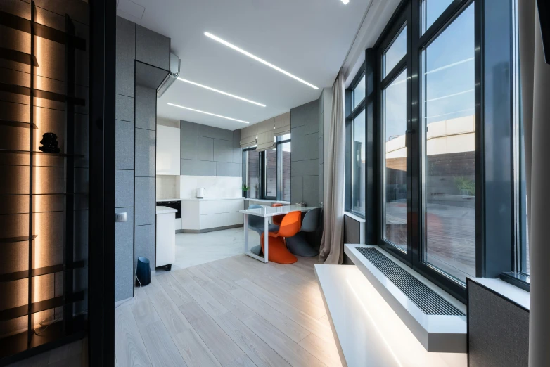 a living room filled with furniture and a large window, by Adam Marczyński, light and space, orange grey white, minimal kitchen, office ceiling panels, lat lighting