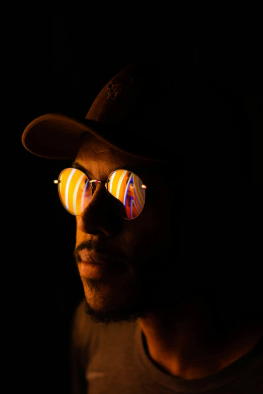 a man wearing sunglasses and a hat in the dark, by Andrew Stevovich, refracted sunset lighting, ( ( dark skin ) ), concept photo, avatar image
