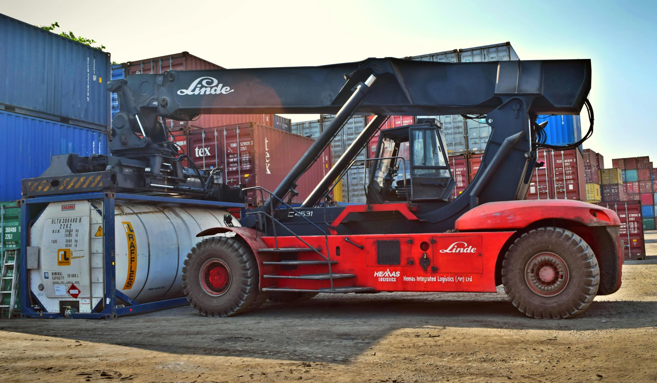 a forklift is parked next to a stack of containers, gutai group, black steel with red trim, yolie leif, high-quality photo, thumbnail