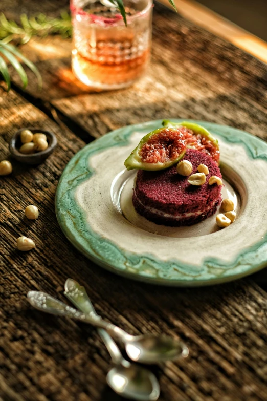 a plate of food sitting on top of a wooden table, inspired by Nadim Karam, red velvet, mayan, gourmet, high quality product image”