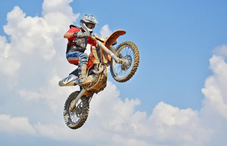 a man flying through the air while riding a dirt bike, pexels contest winner, figuration libre, sassy pose, mechanic, high in the sky, profile image