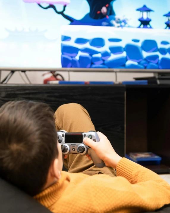 a person sitting on a couch playing a video game, by Julia Pishtar, trending on pexels, lgbt, subreddit / r / whale, panoramic shot, game board