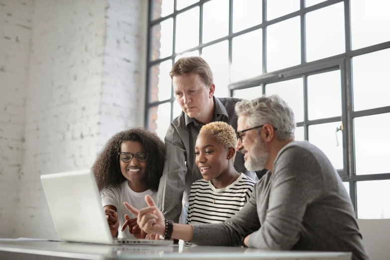 a group of people gathered around a laptop, by Carey Morris, pexels, renaissance, 15081959 21121991 01012000 4k, profile picture, diverse ages, commercial photo