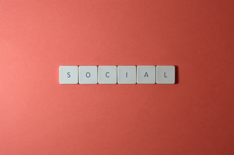 the word social spelled with white tiles on a red background, by Sylvia Wishart, trending on pexels, serial art, square, on a pale background, nursing, panel