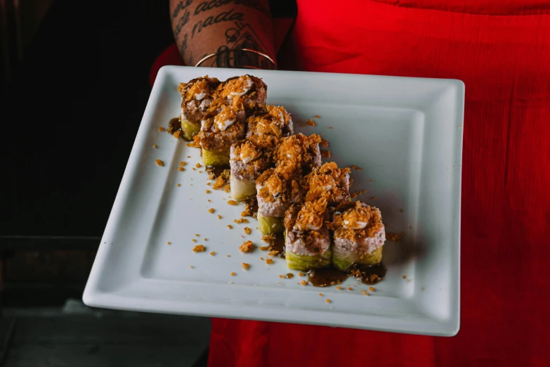 a close up of a person holding a plate of food, ninja scrolls, dessert, profile image, view from the side