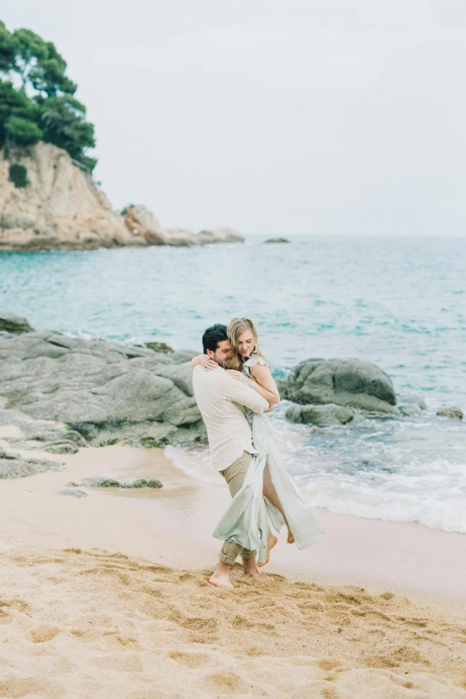 a man carrying a woman on the beach, unsplash, renaissance, 2 5 6 x 2 5 6 pixels, bride and groom, in barcelona, sparkling cove