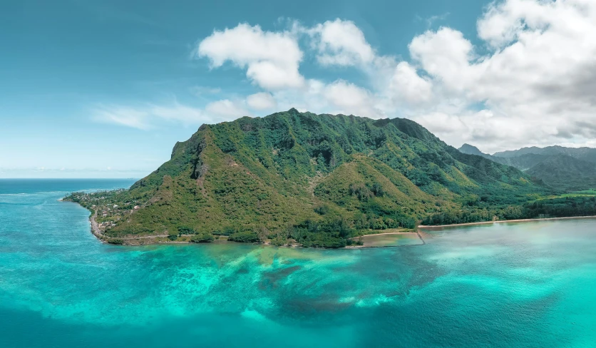 an island in the middle of the ocean, inspired by Kanō Tan'yū, pexels contest winner, hurufiyya, “ aerial view of a mountain, polynesian style, thumbnail, vacation photo