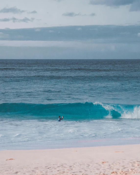 a man riding a wave on top of a surfboard, by Robbie Trevino, pexels contest winner, minimalism, red sand beach, pastel blues and pinks, sitting down, instagram story