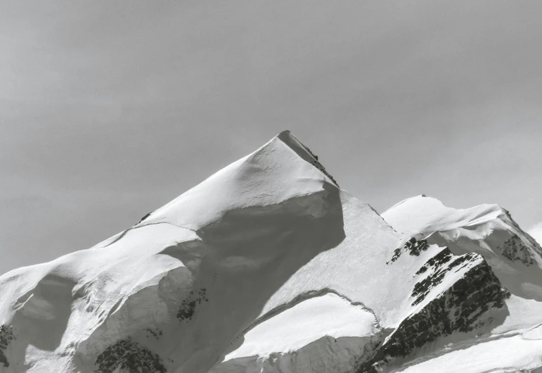 a man riding a snowboard down the side of a snow covered mountain, a black and white photo, by Matthias Weischer, minimalist photorealist, mountains of ice cream, tengri, snow camouflage
