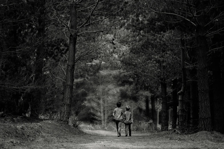 a black and white photo of two people walking in the woods, by Lucia Peka, pixabay, boy, arrendajo in avila pinewood, the road, rending on cgsociety