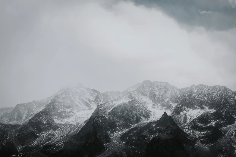 a black and white photo of snow covered mountains, unsplash contest winner, minimalism, 4 k hd wallpapear, grey sky, cinematic 4k octane render, high res 8k