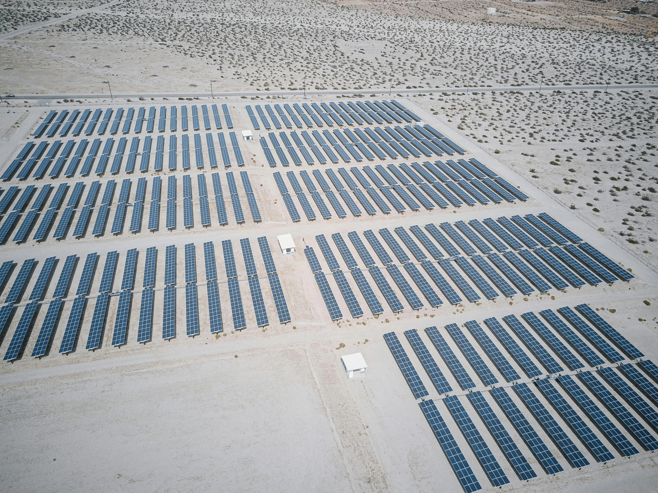 a large array of solar panels in the desert, a portrait, by Carey Morris, unsplash, dau-al-set, on an empty stage from above, square, high quality photo, jen atkin