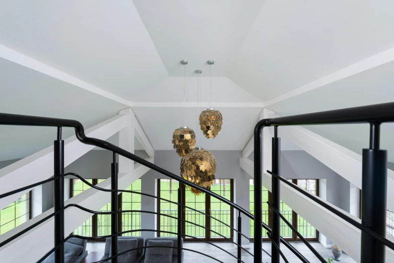 a living room filled with furniture and a chandelier, inspired by Reinier Nooms, unsplash, light and space, penrose stairs, hexagonal shaped, general studio lighting, vaulted ceiling