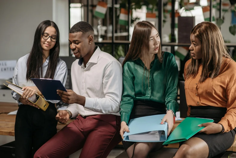 a group of people sitting next to each other on a bench, trending on pexels, sitting in the classroom, avatar image, ethnic group, professional image