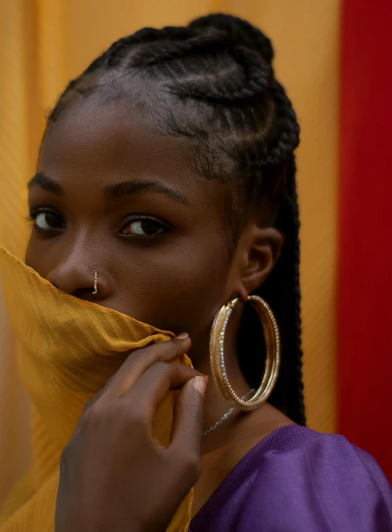 a woman with a scarf covering her face, an album cover, inspired by Ras Akyem, trending on pexels, gold hoop earings, earring, maria borges, color photograph portrait 4k