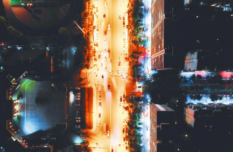 an aerial view of a city at night, an album cover, pexels contest winner, streetlamps with orange light, hyperdetailed photo, merge, gif