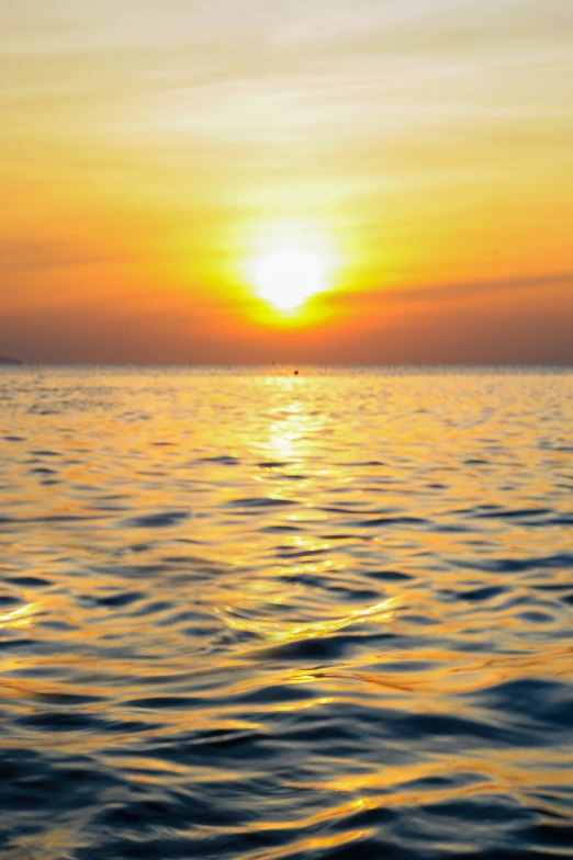 a large body of water with a sunset in the background, happening, ocean view, sunny environment, heat ripples, gulf of naples