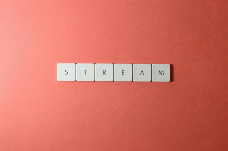 the word stream spelled in scrabbles on a pink surface, trending on pexels, aestheticism, screens, cream, hygge, from valve
