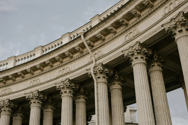 a clock that is on the side of a building, a marble sculpture, inspired by Hubert Robert, pexels contest winner, neoclassicism, arches adorned pillars, background image, victorian arcs of sand, grand library