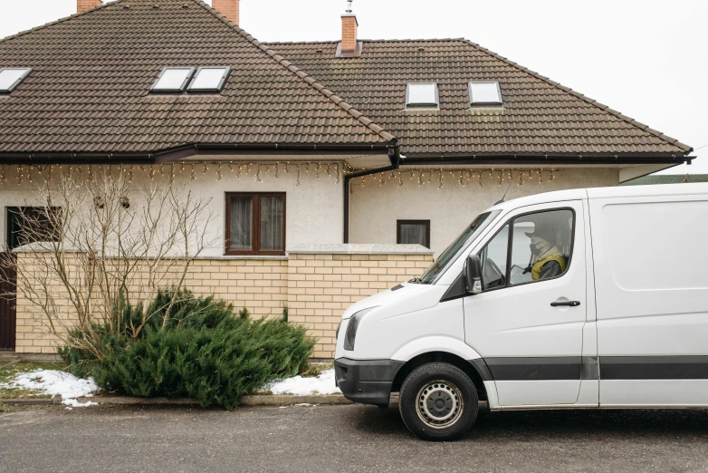 a white van parked in front of a house, postminimalism, profile image, winter season, maintenance photo, avatar image