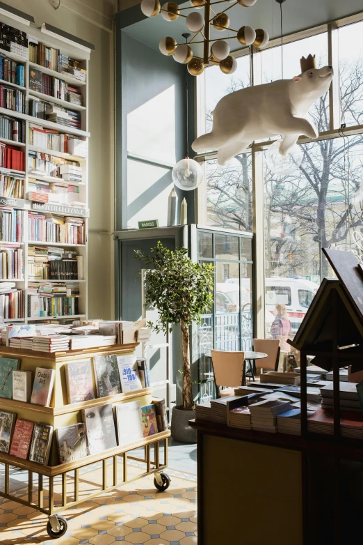 a room filled with lots of books next to a window, private press, helsinki, storefront, overlooking, thumbnail