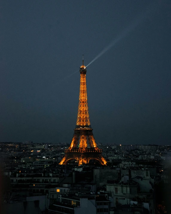 the eiffel tower is lit up at night, an album cover, pexels contest winner, lgbtq, leaked photo, no cropping, nice view