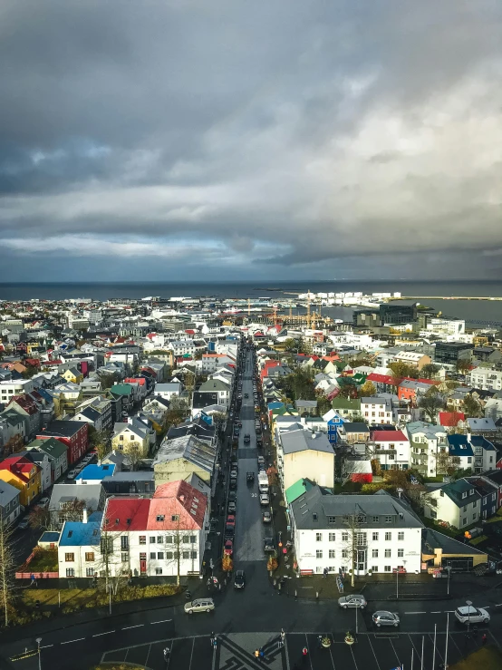 an aerial view of a city on a cloudy day, a picture, happening, iceland photography, square, highly colorful, high quality screenshot