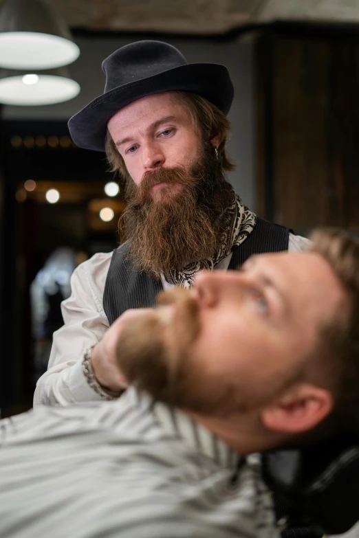 a man getting a haircut at a barber shop, a portrait, by Jaakko Mattila, renaissance, waxed beard, costumes from peaky blinders, thumbnail, slide show