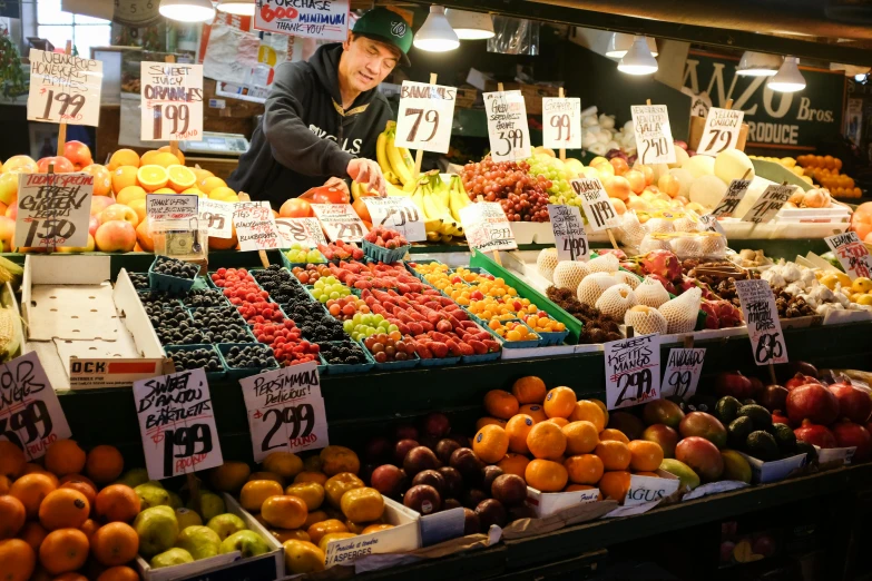 a man standing in front of a fruit stand, a photo, seattle completely wasted away, avatar image, fish seafood markets, thumbnail