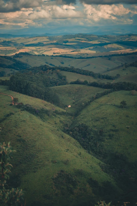 a view of the countryside from the top of a hill, by Elsa Bleda, unsplash contest winner, shipibo, australia, downhill landscape, bocage