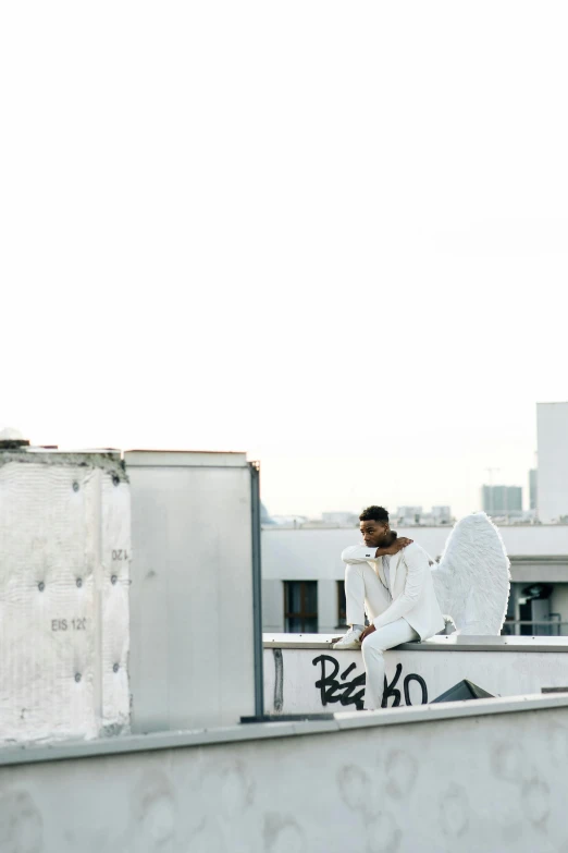 a man riding a skateboard on top of a roof, an album cover, by Niko Henrichon, unsplash, happening, white wings, playboi carti portrait, los angeles 2 0 1 5, all white