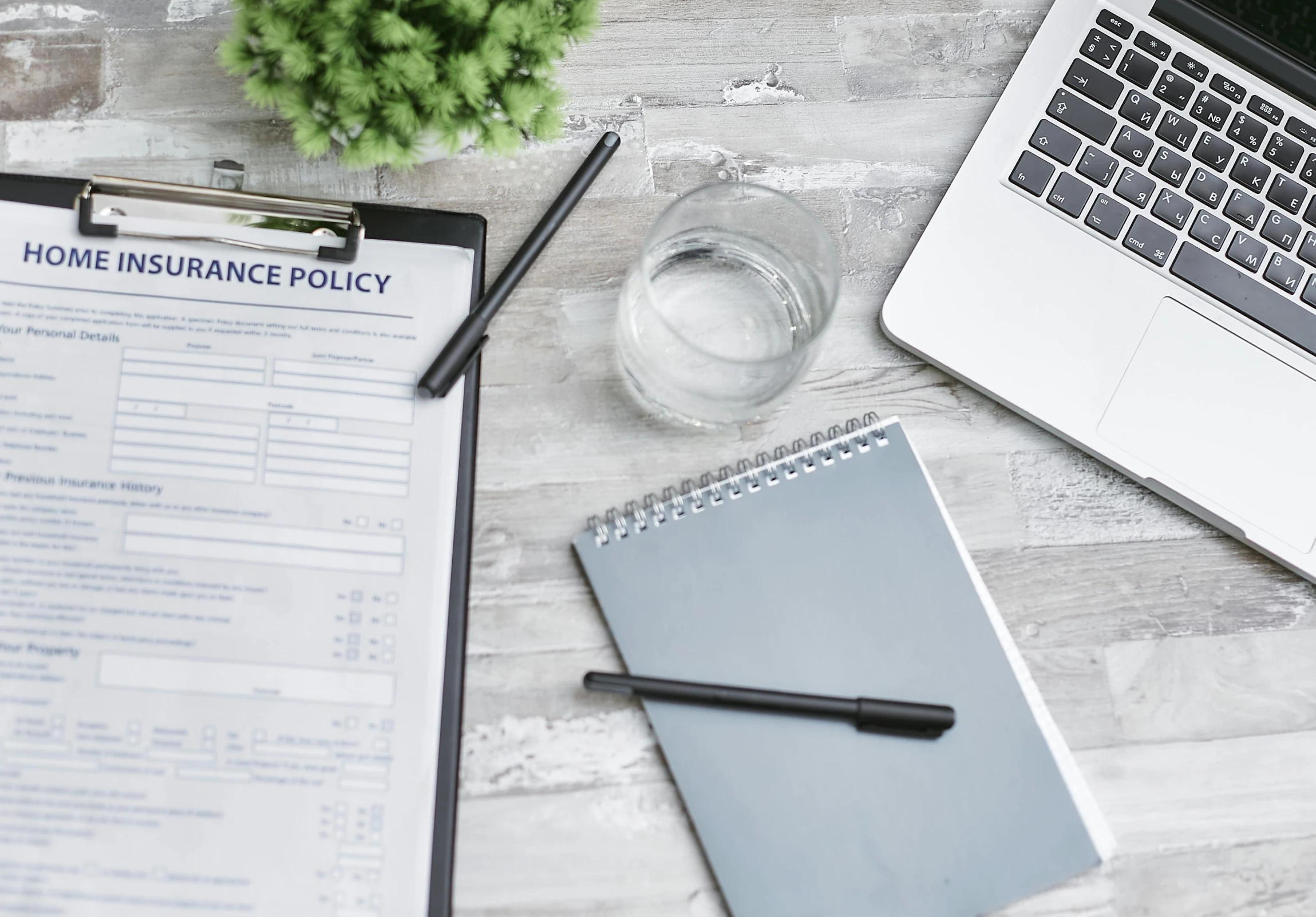 a clipboard sitting on top of a desk next to a laptop, by Carey Morris, pexels, renaissance, selling insurance, background image