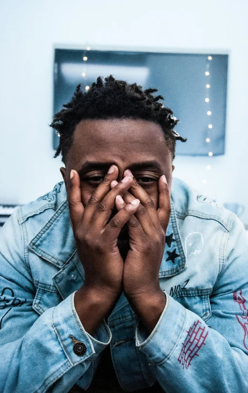 a man covers his face with his hands, an album cover, trending on pexels, giga chad crying, ( ( dark skin ) ), 15081959 21121991 01012000 4k, man sitting facing away