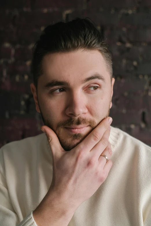 a man posing for a picture in front of a brick wall, a character portrait, inspired by Serhii Vasylkivsky, portrait of florence pugh, intricate heterochromia sad, headshot profile picture, jacksepticeye