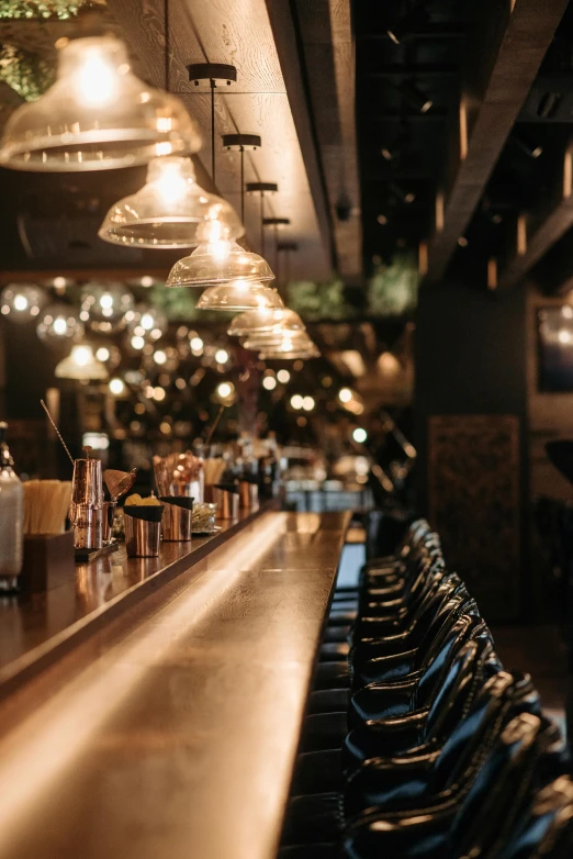 a row of chairs sitting next to a bar, a portrait, trending on unsplash, lots of lights, thumbnail, 1 2 9 7, tavern