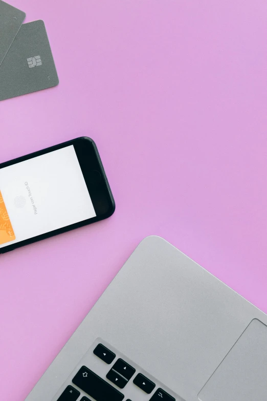 a cell phone sitting on top of a laptop next to a credit card, trending on unsplash, hypermodernism, pink and orange, square, material design, low quality photo