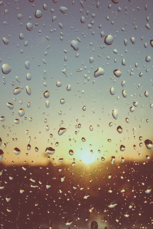 a person standing in front of a window covered in rain, an album cover, trending on unsplash, romanticism, golden hour closeup photo, tear drops, sunfaded, :: morning