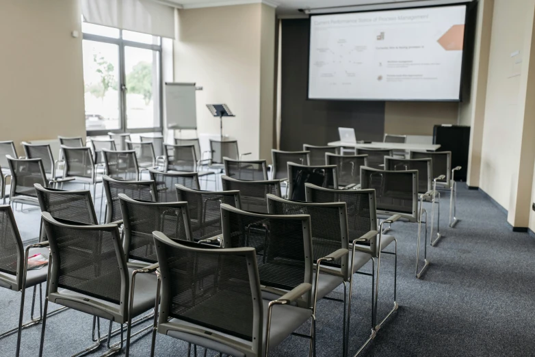 a room filled with chairs and a projector screen, a portrait, unsplash, danube school, sharp focus ilustration hq, overview, full daylight, beautiful high resolution