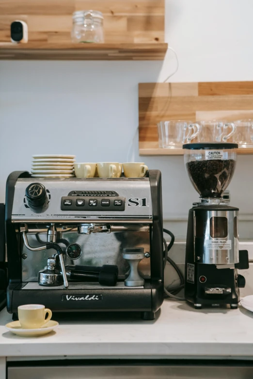 a coffee machine sitting on top of a kitchen counter, by Robbie Trevino, pexels contest winner, daily specials, gif, bakery, profile image