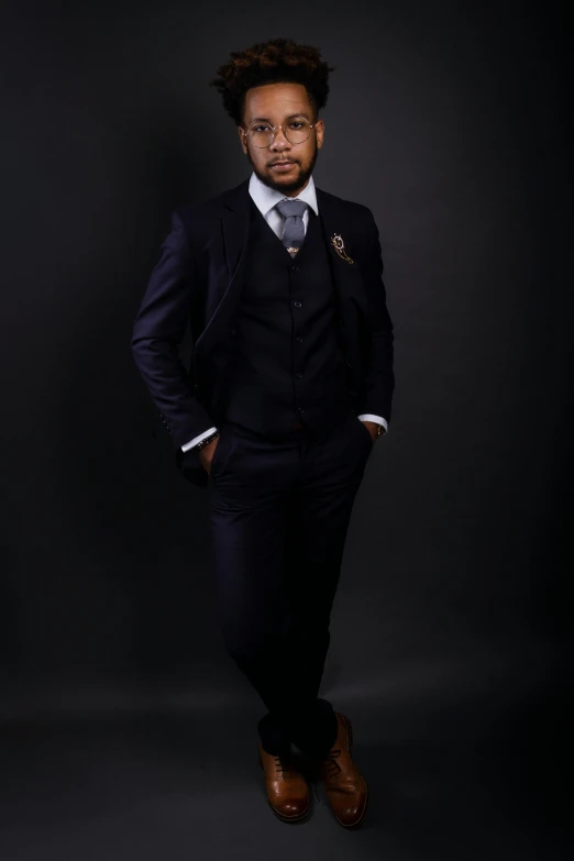 a man in a suit standing in front of a black background, an album cover, by Chinwe Chukwuogo-Roy, pexels, three piece suit, full body and head shot, professional photo-n 3, high quality upload