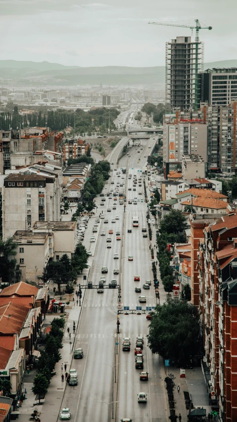 a city street filled with lots of traffic next to tall buildings, by Alejandro Obregón, pexels contest winner, renaissance, turkey, highways, thumbnail, high view