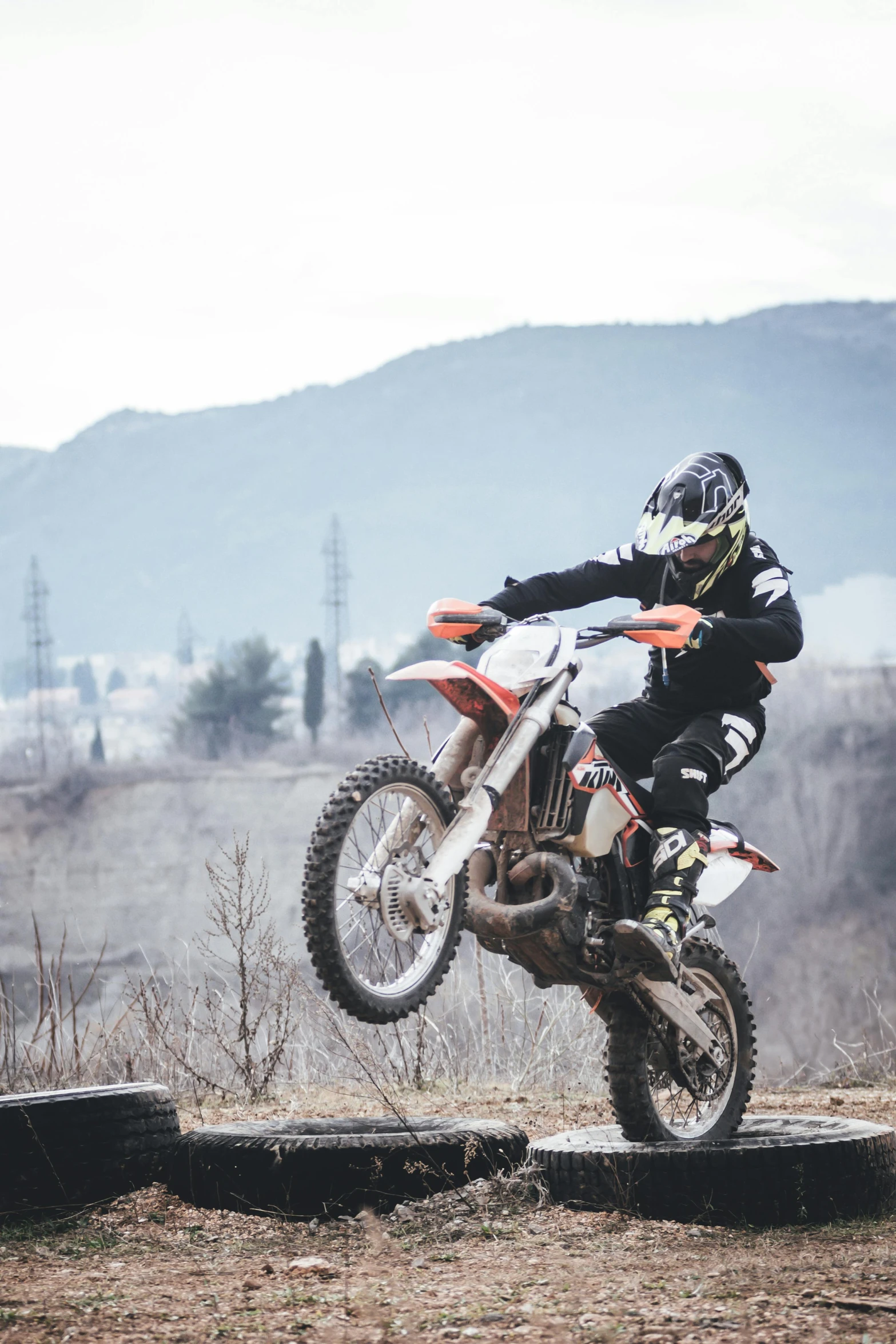 a man flying through the air while riding a dirt bike, pexels contest winner, figuration libre, orange grey white, a handsome, university, profile image