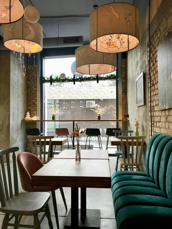 a room filled with lots of tables and chairs, a portrait, by Emma Andijewska, unsplash, great textures and lighting, in a bright cafe, thumbnail, winter setting