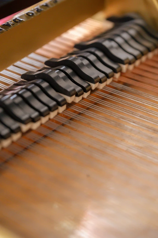 a close up of the keys of a piano, by David Simpson, weaving, in a workshop, soft volume absorbation, multiple layers